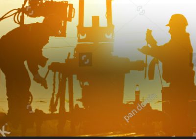 Workers in hard hats working on equipment