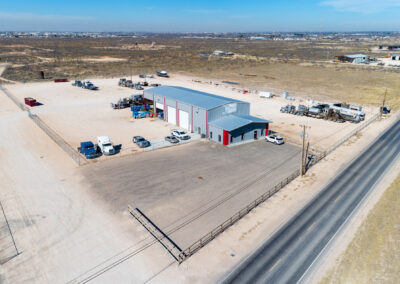 Exterior of commercial building with cars parked outside