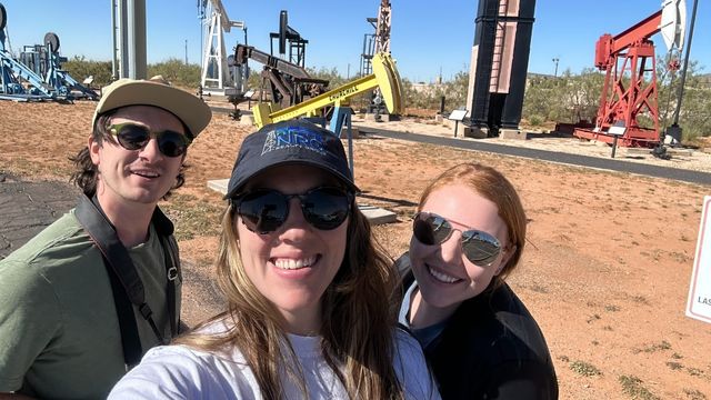 NRG Realty Group employees smiling for photo at construction site